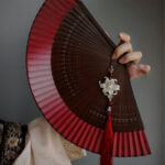 Buddha Stones Red Lily Tassel Hollow Rib Silk Handheld Bamboo Folding Fan