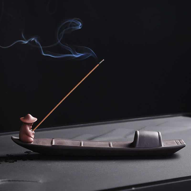 1735304412_8852ebae-5bf4-4106-beff-8ad949be4026 Buddha Stones Fisherman Boat Purple Clay Peace Healing Ceramic Stick Incense Burner Decoration - Image 1