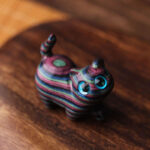 FREE Today: Healing and Protection Colored Sandalwood Carved Tilt Head Cat Decoration