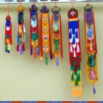 Buddha Stones Lotus Flower Eight Auspicious Symbols Meditation Enlightenment Colorful Tassels Wall Art