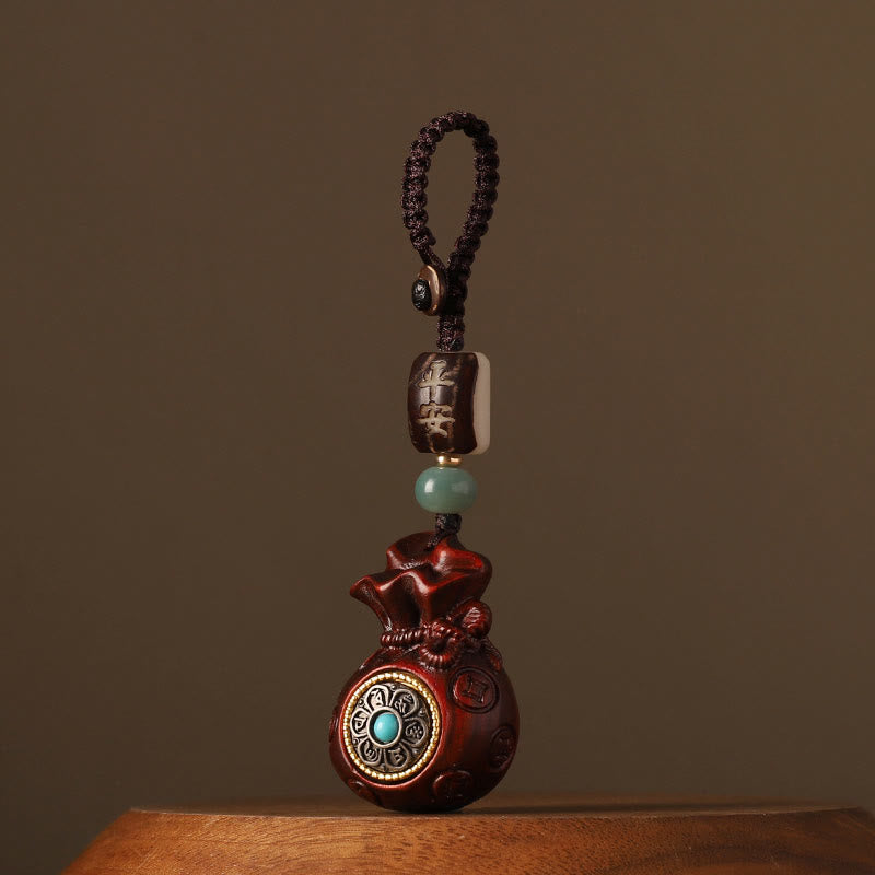 41ed61ee4675c6183959685a1c7c8bf9_abf9d84b-b598-4746-8f07-5b832ff074a6 Buddha Stones Small Leaf Red Sandalwood Green Sandalwood Money Bag Om Mani Padme Hum Rotatable Protection Hanging Decoration - Image 1