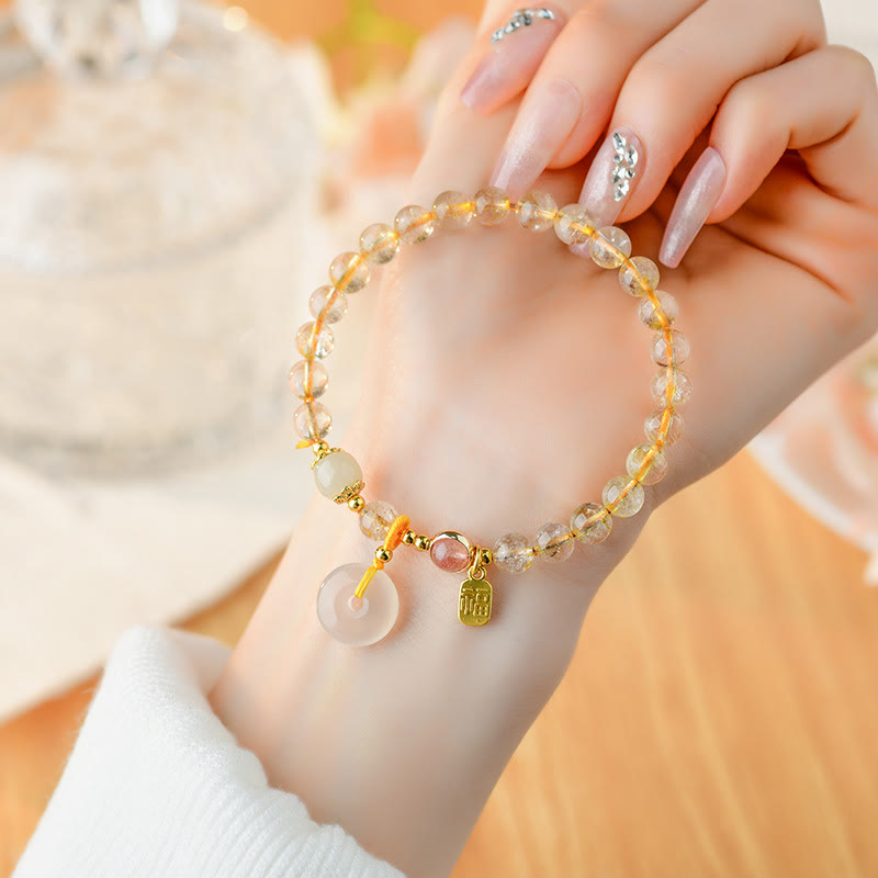 ebf70eeecd9ff16a105a5e45fa504417 Buddha Stones Natural Golden Rutilated Quartz Fu Character Peace Buckle Charm Wealth Bracelet - Image 1
